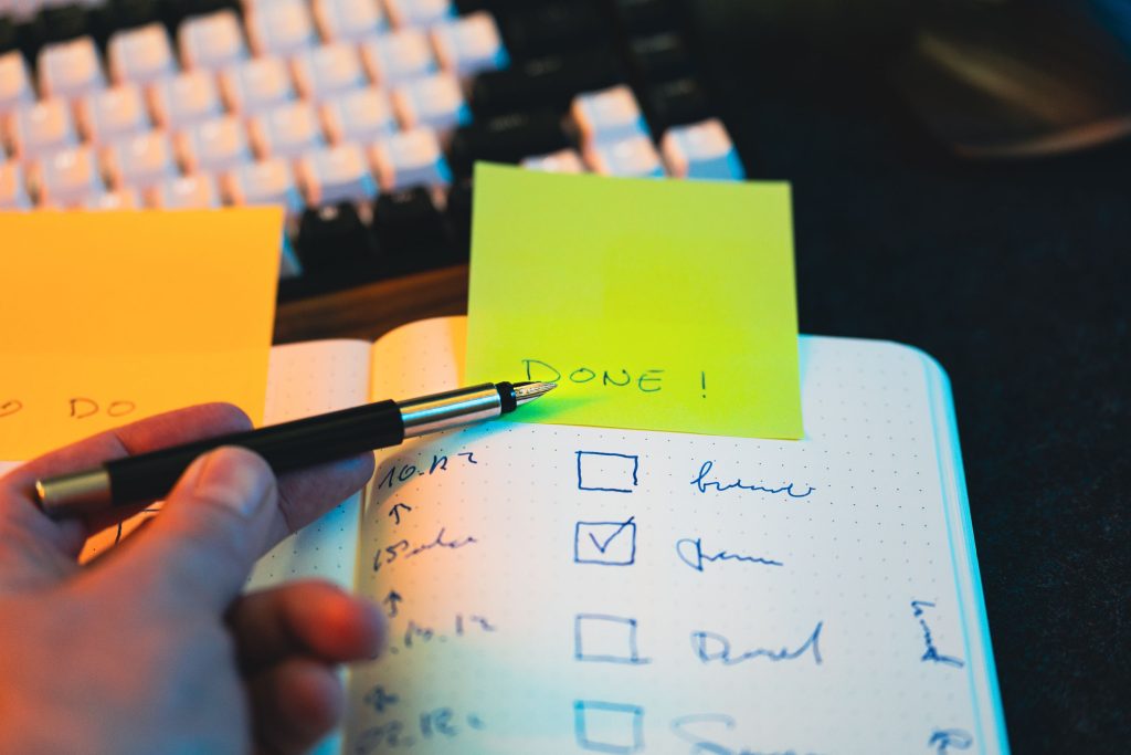 notebook written financial goals desk