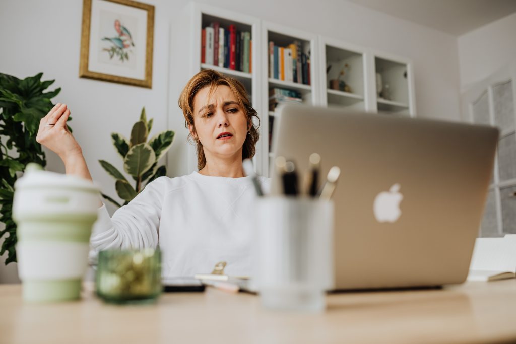 woman working laptop desk mug